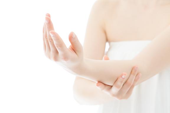 Beautiful young woman hands on white background